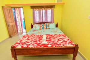 a bedroom with a bed made out of legos at Pramod Bhawan , Port Blair in Port Blair