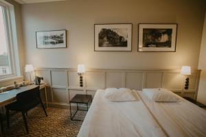Postel nebo postele na pokoji v ubytování Coop Hotell