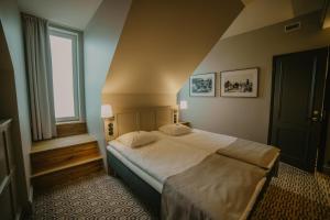 Postel nebo postele na pokoji v ubytování Coop Hotell