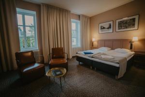 Postel nebo postele na pokoji v ubytování Coop Hotell