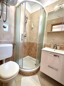 a bathroom with a shower and a toilet and a sink at Villa Punta in Zadar +51 photos