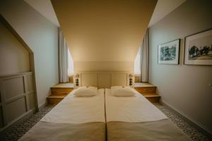 Postel nebo postele na pokoji v ubytování Coop Hotell