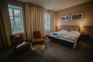 Postel nebo postele na pokoji v ubytování Coop Hotell