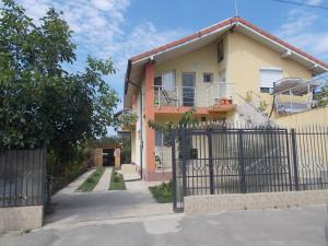 a house with a gate in front of it at Vila Rapsodiei in Constanţa