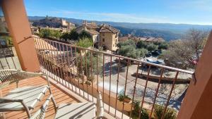 a balcony with a view of a town at Hotel Vinoteca Alquezar - Adults Only - in Alquézar
