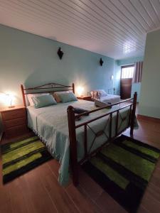 Кровать или кровати в номере Casa das Escadinhas