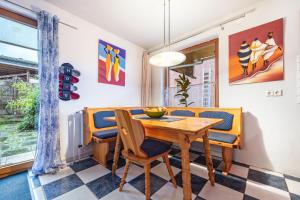 a dining room with a wooden table and chairs at Grosszügige Fewo in Heckenbeck in Bad Gandersheim