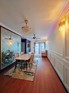 a dining room with a table and chairs at QM Homestay in Semenyih