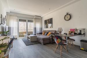 a living room with a couch and a table at Brigth- Pool Parking-1Bd 1Bth-Prado in Madrid