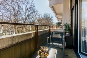 a balcony with a bowl of fruit on a table at Brigth- Pool Parking-1Bd 1Bth-Prado in Madrid