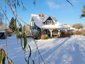 a house with a snow covered yard at Ferienhaus" Blaubeer" in Michaelsdorf in Michaelsdorf