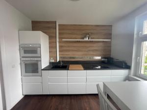 Η κουζίνα ή μικρή κουζίνα στο Ferienwohnung "Der Nautilus"