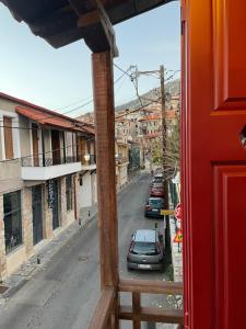 a view from a window of a street with cars at Traditional residence in Arachova center in Arachova