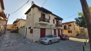 a small car parked in front of a building at Traditional residence in Arachova center in Arachova