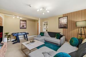a living room with a couch and a table at Stunning Penthouse On Bristols Harbourside in Bristol