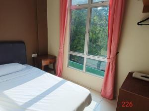 Postel nebo postele na pokoji v ubytování Doris Hotel