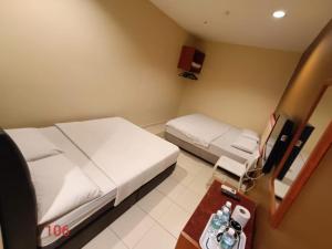 Postel nebo postele na pokoji v ubytování Doris Hotel