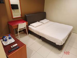 Postel nebo postele na pokoji v ubytování Doris Hotel