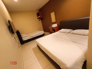 Postel nebo postele na pokoji v ubytování Doris Hotel