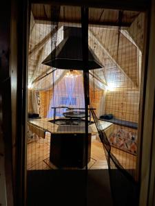 a view of a kitchen through a glass door at Private Lakeside Retreat in Renac