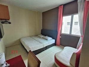 Postel nebo postele na pokoji v ubytování Doris Hotel