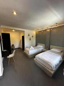 Posteľ alebo postele v izbe v ubytovaní Pondok Sentana Guest House