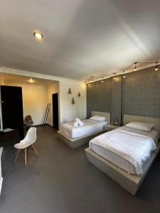Posteľ alebo postele v izbe v ubytovaní Pondok Sentana Guest House