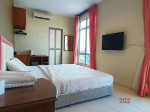 Postel nebo postele na pokoji v ubytování Doris Hotel