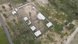 an overhead view of a yard with white structures at Palm Beach Resort Ceylon in Jaffna