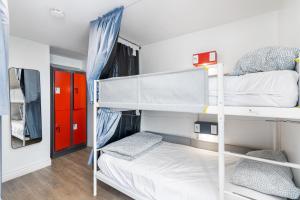 a bedroom with two bunk beds in a room at Samesun Toronto in Toronto