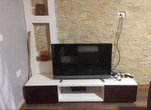 a flat screen tv sitting on top of a tv stand at FeWo Port Ghalib in Port Ghalib