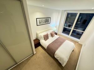 Ένα ή περισσότερα κρεβάτια σε δωμάτιο στο London East Side Wharf