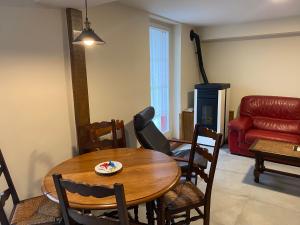a living room with a table and a couch at Magdalenea - Apartamento in Lesaka
