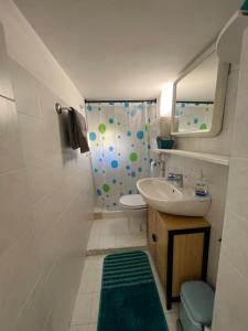 a small bathroom with a sink and a shower at Addendum B&B in Pescara