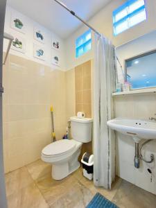a bathroom with a toilet and a sink at Chalong Interview Condominium - Chalong in Chalong 