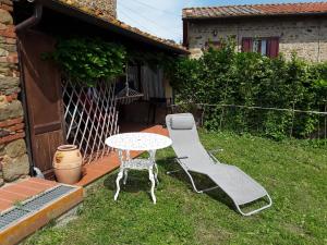 a table and two chairs and a table and chairs at Poderino La Noce in Vinci