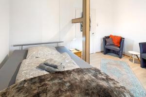 a bedroom with a bed and a chair at Vogelsberger Bett 5 die 1 in Alsfeld