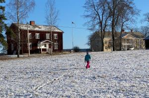 a person standing in a snow covered field at Sölje Herrgård Annexet in Glava +6 photos