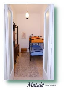 an open door to a bedroom with a bunk bed at Matalé - casa vacanze in Taranto