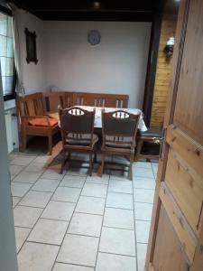 a kitchen and dining room with a table and chairs at Wacholderweg 10,Hans Hyzak in Düsseldorf