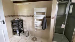a shower in a bathroom with a glass shower stall at Bonnes Routes - 4 star gite in the Perigord Vert in La Coquille +30 photos