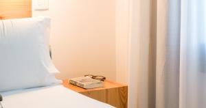 Posteľ alebo postele v izbe v ubytovaní Hotel Catalina