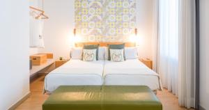 Posteľ alebo postele v izbe v ubytovaní Hotel Catalina