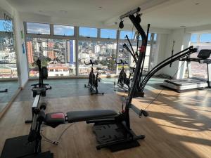 a gym with a view of a city at Cityhaus apartment zone 10 near hotel area in Guatemala