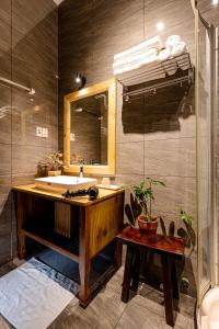 a bathroom with a sink and a shower at Villa De Pastry Vesta Collections in Ho Chi Minh City