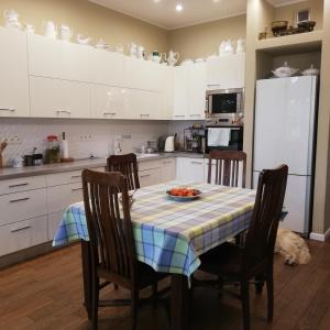 a kitchen with a table with a plate of fruit on it at Botaniczny Pokój in Kraków