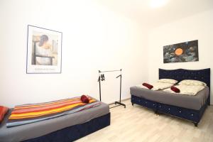 Łóżko lub łóżka w pokoju w obiekcie Cozy Rooms in Pragerstrasse