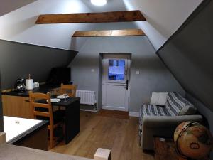 a living room with a couch and a table at Braemorriston Lodge, Elgin in Elgin