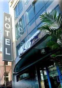 a store with a sign on the front of a building at Hotel Fors in Burgas City