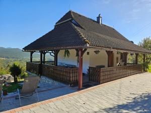 a gazebo with a roof on a patio at Cozy House Zivko with Balcony in Plitvička Jezera